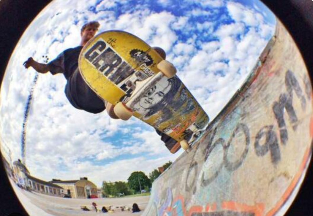 Fisheye color skateboarding photo at a skatepark